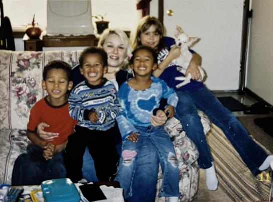 A group of children sitting on a couch