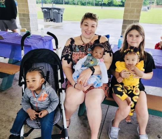 A group of people sitting on a bench
