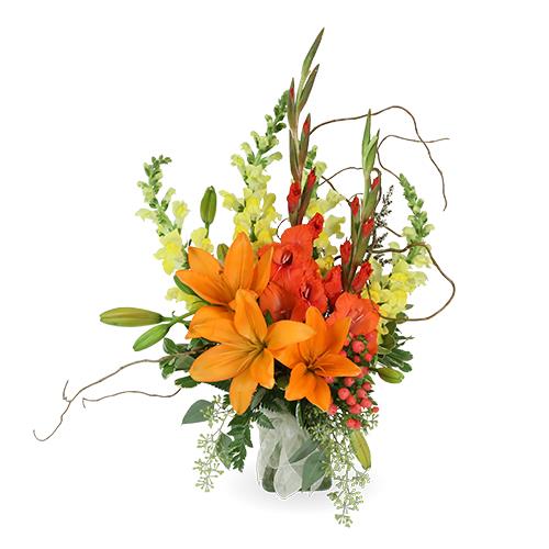 A colorful arrangement showcases orange lilies, red gladiolus, and yellow snapdragons.