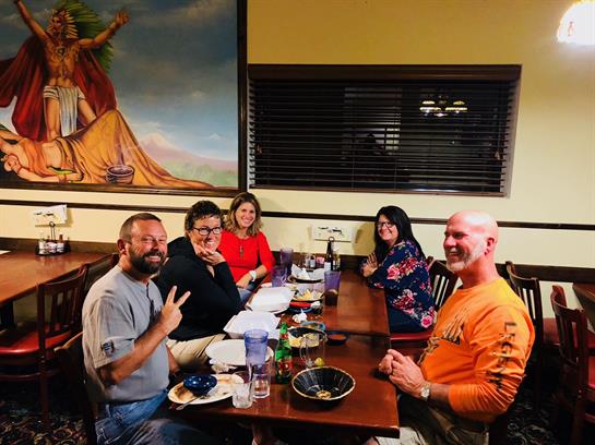A group of people sitting at a table