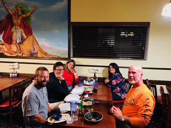 A group of people sitting at a table