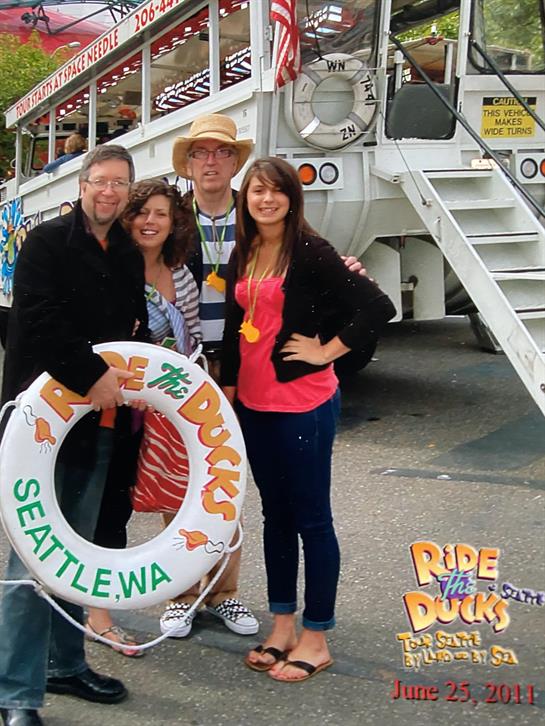 Friends pose together on a Ride the Ducks tour in Seattle, celebrating a memorable outing.