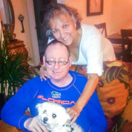 A man and woman posing for a picture