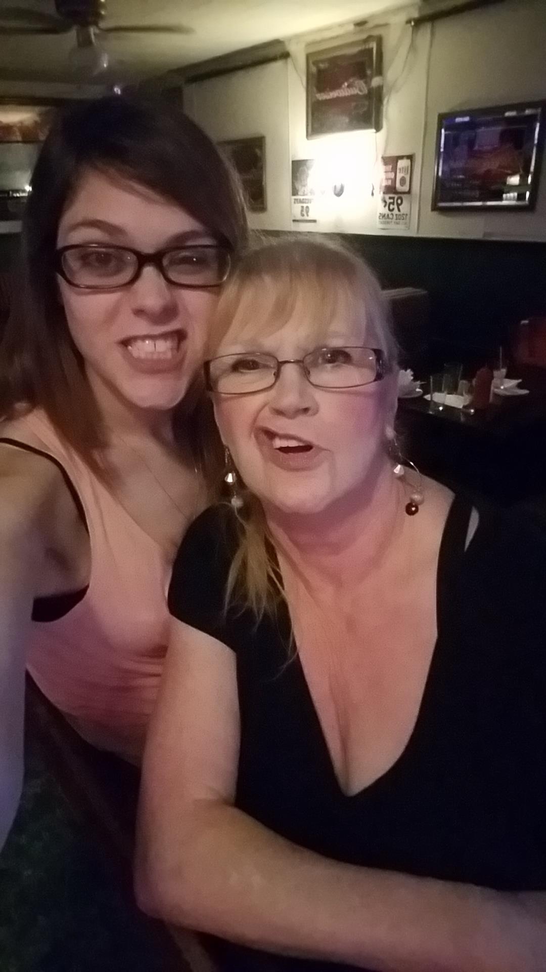 Friends share smiles and laughter together while dining in a vibrant restaurant atmosphere.