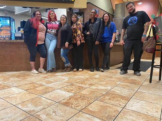 A group of people standing in a room