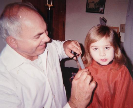 A man cutting a child's hair