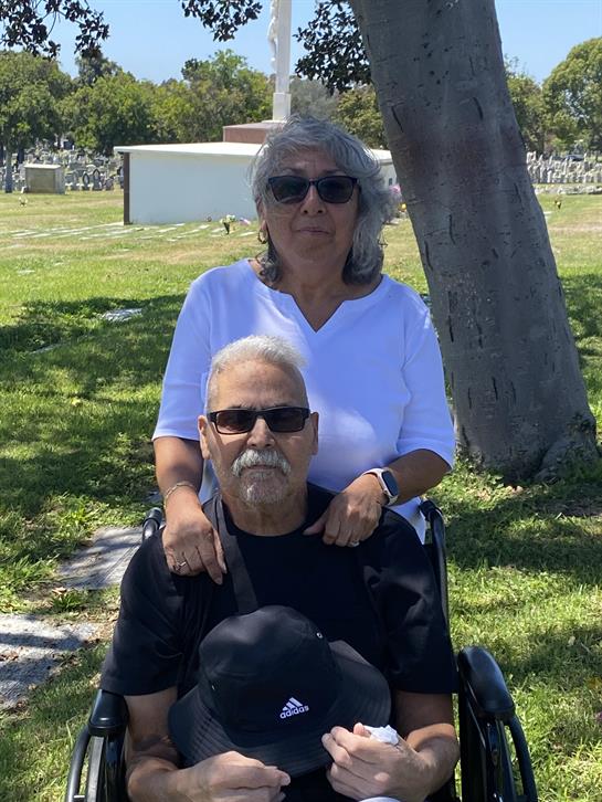 Seniors share a moment at the cemetery, enjoying the warm weather and each other’s company.