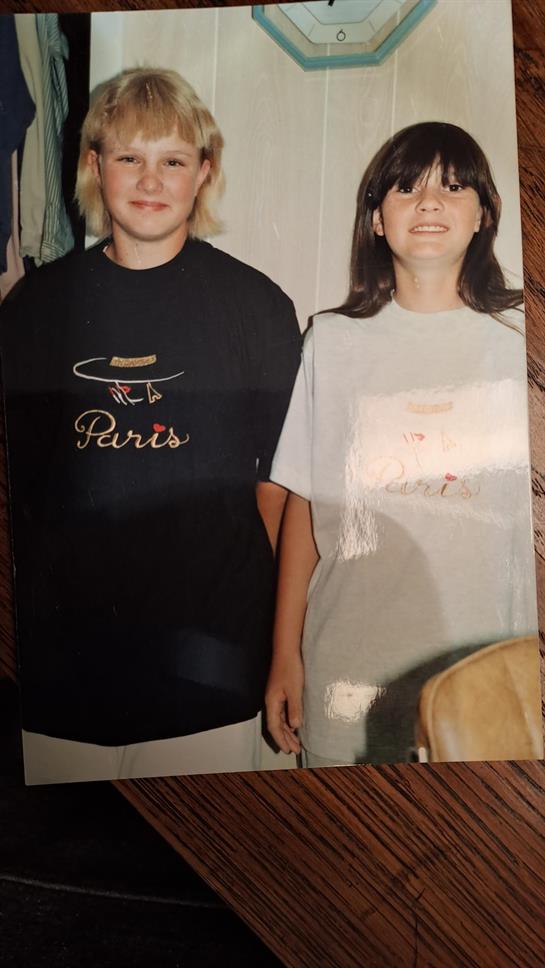 A boy and girl standing next to each other