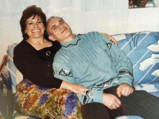 A man and woman sitting on a couch