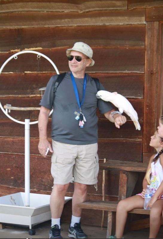 A man holding a white bird