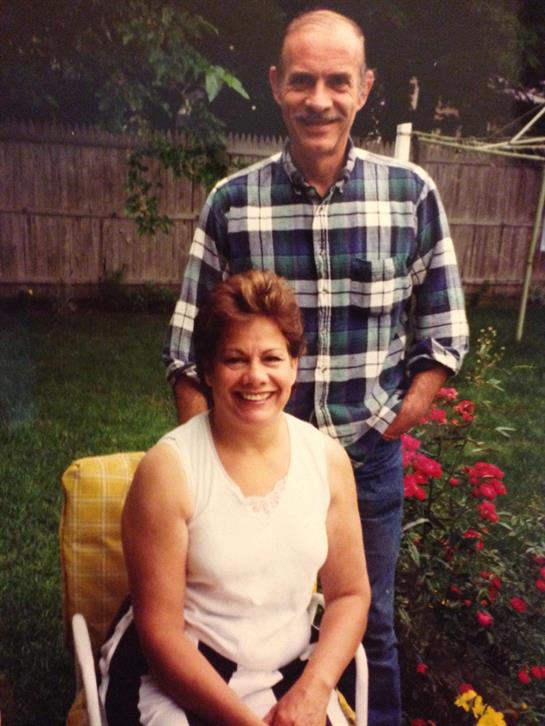 A man and woman in a wheelchair