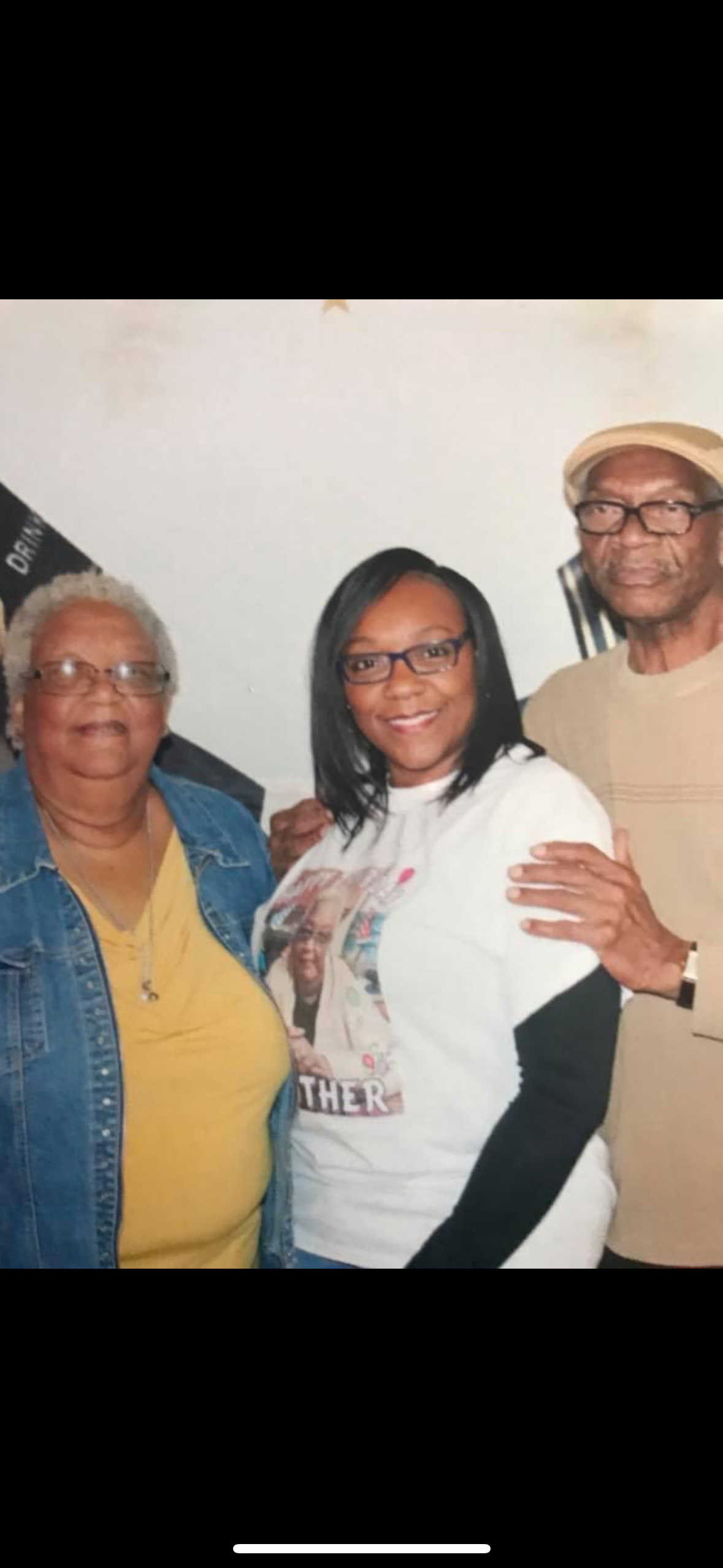 Three family members enjoy a joyful moment together, radiating warmth and happiness.