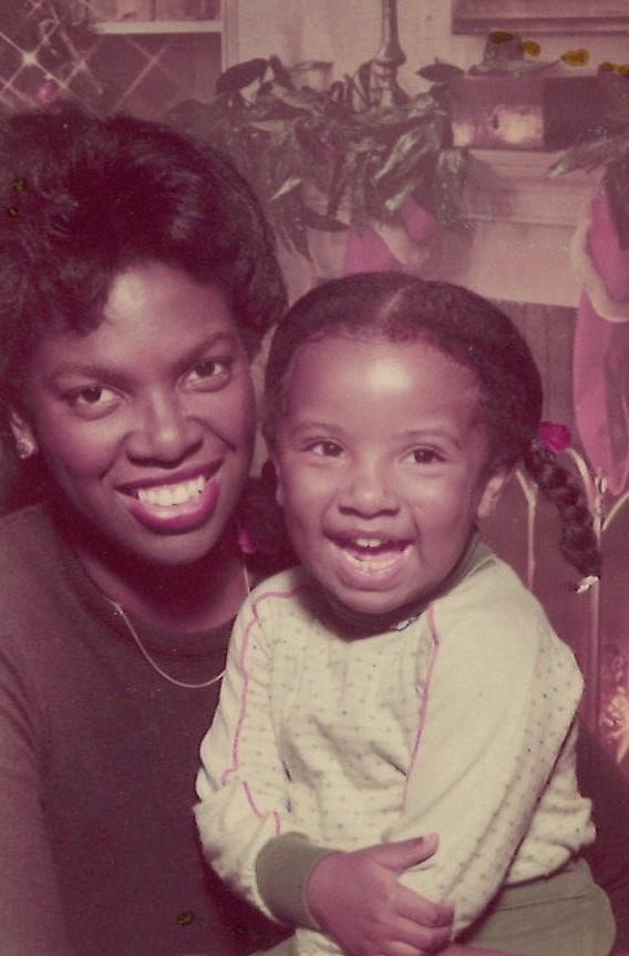 A woman and a child smiling