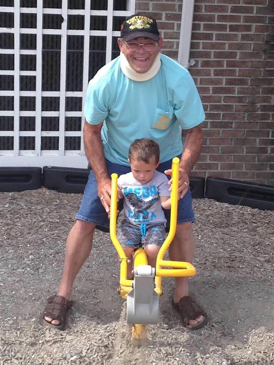 A man and child on a playground