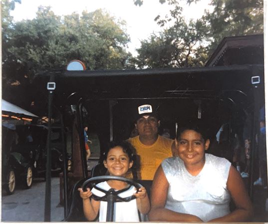 A group of people in a golf cart