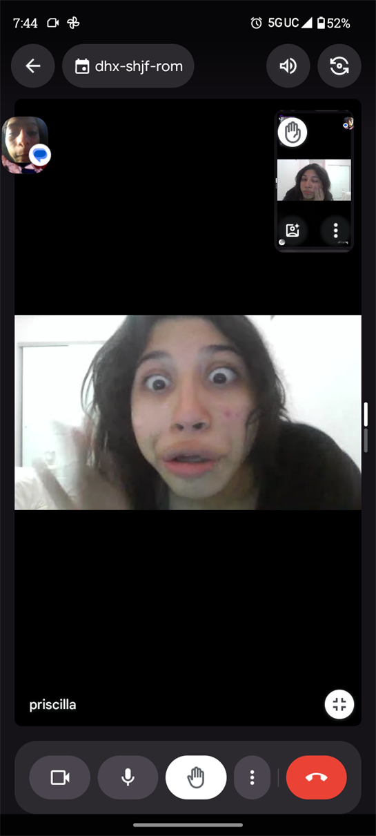 Individual displays a shocked expression while lounging on a bed at home.