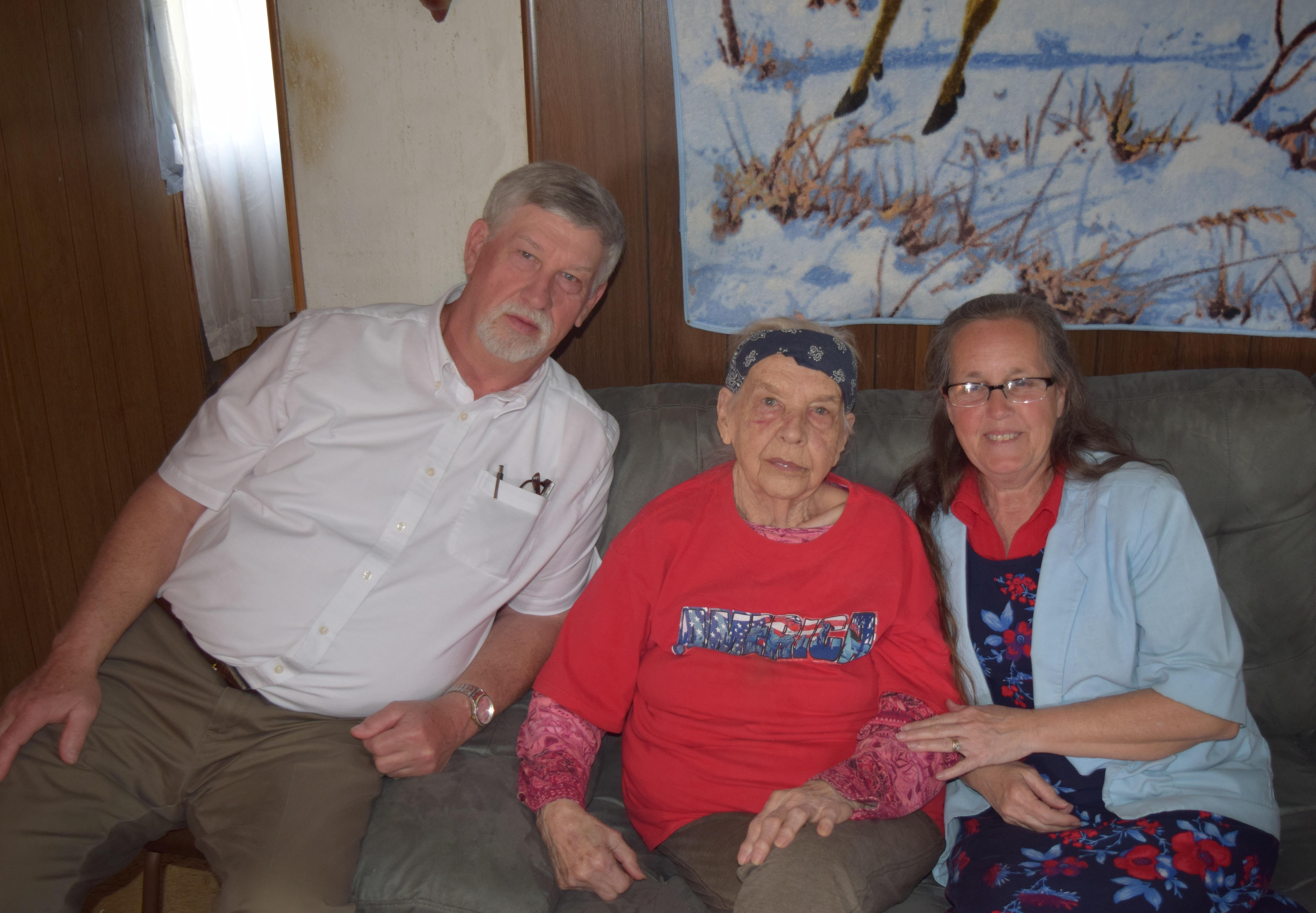 A family gathers together in a warm living room, capturing moments of joy and connection.