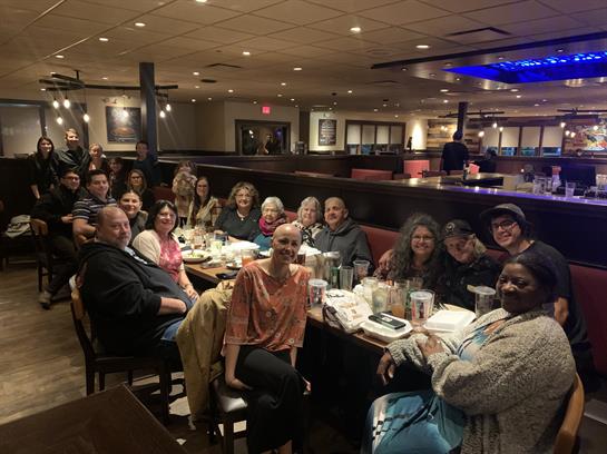 A group of people sitting at a table
