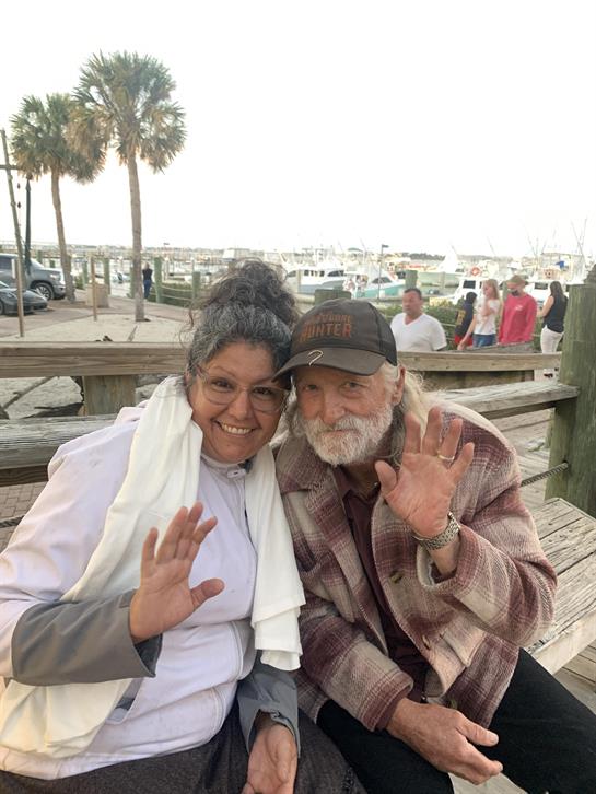 A man and woman sitting on a bench