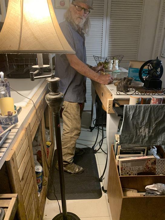 A man standing in a kitchen