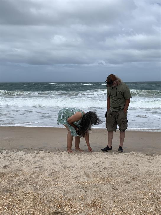 A man and woman on a beach