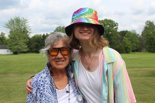 A woman and a young woman posing for a picture