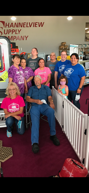 A group of smiling individuals pose together, celebrating community and connection in Channelview.