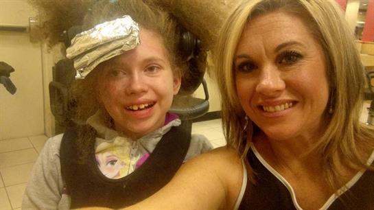 A woman and a child smiling