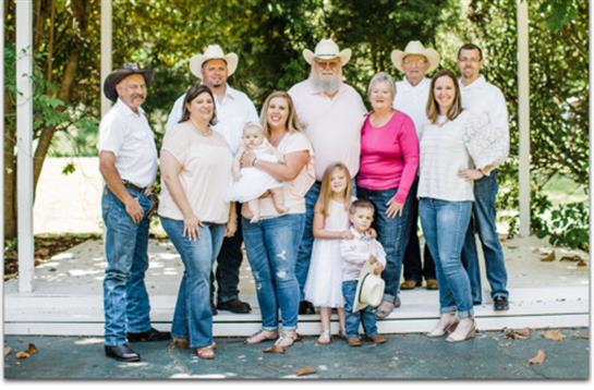 Family enjoys a joyful outdoor gathering, celebrating love and togetherness across generations.