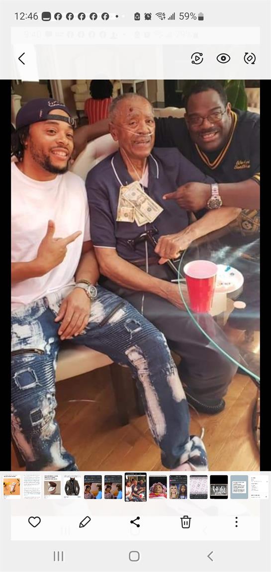 A man sitting next to another man