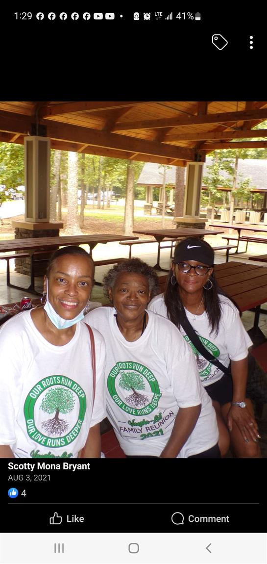 A group of women sitting under a shelter