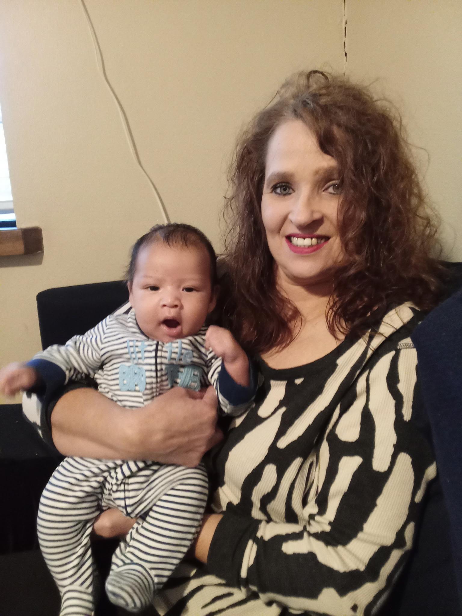A woman holding a baby