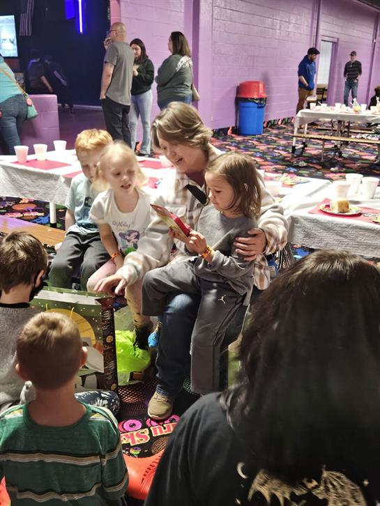 A group of people sitting on the floor