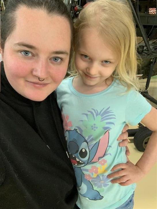A woman and a girl posing for a selfie