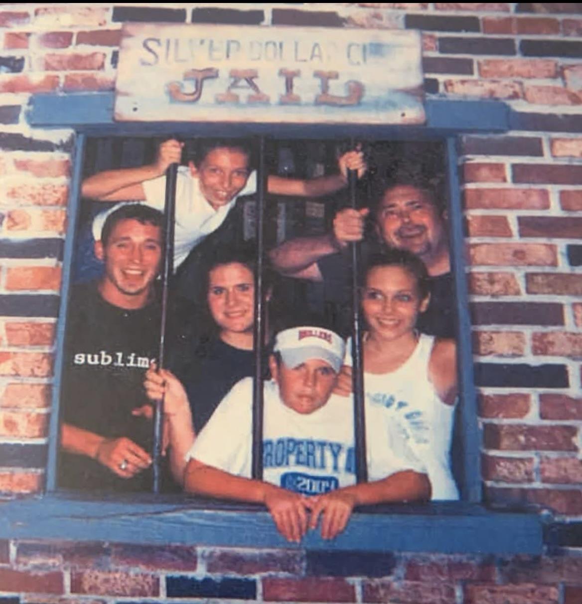 A group of people in a jail window