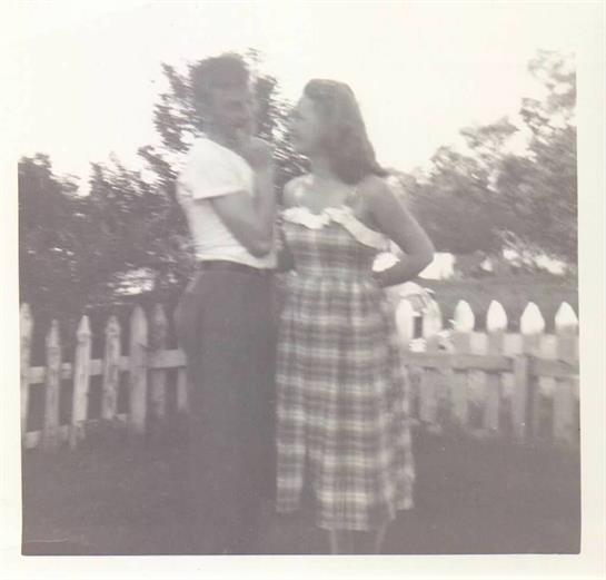 A man and woman standing next to each other