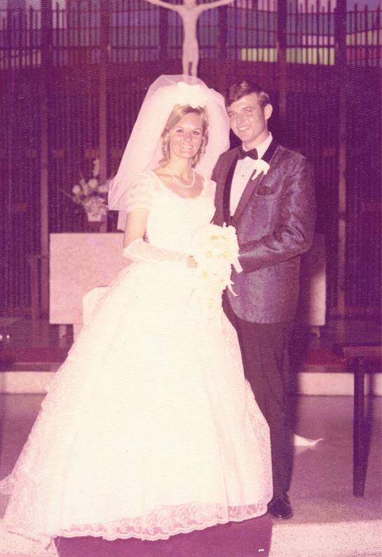 A man and woman in wedding attire