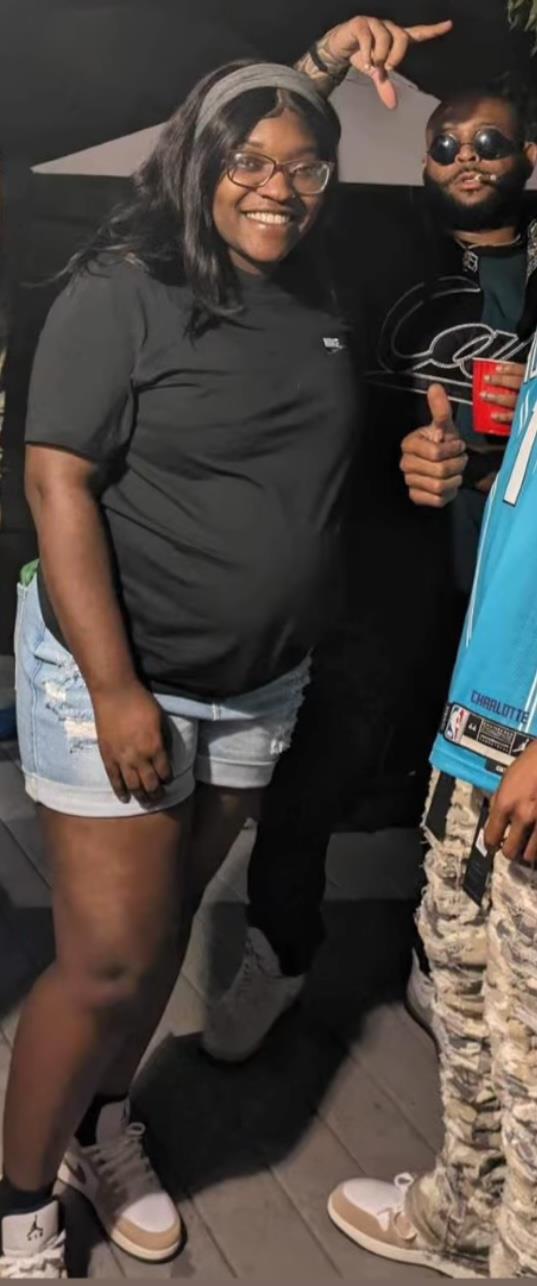 Friends gather together, smiling and posing for photos while having fun at night.