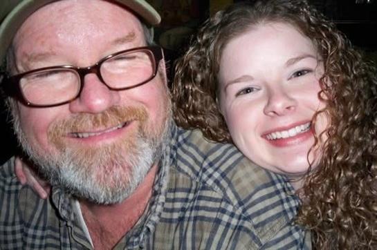 A man and woman smiling for a selfie