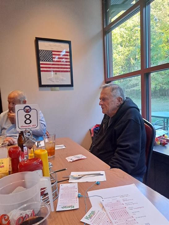 A group of men sitting at a table