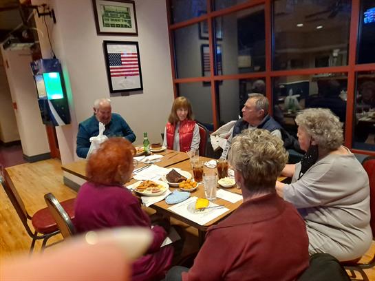 A group of people sitting around a table