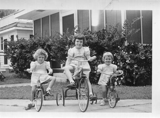 A group of children riding bicycles