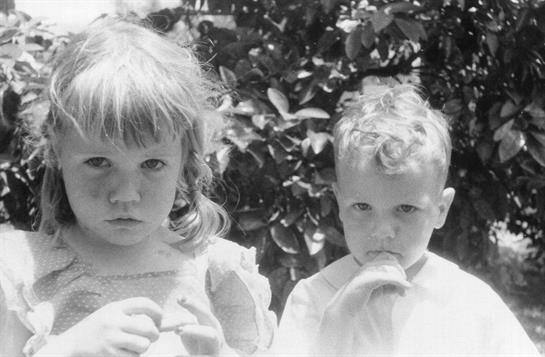 A close-up of a boy and girl