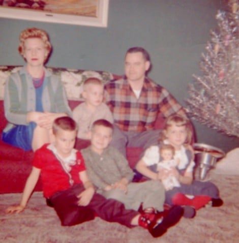 A family sitting on a couch