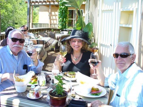 A group of people sitting at a table with drinks