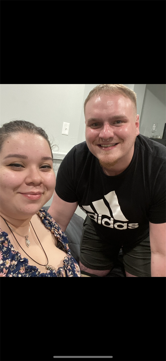 A man and woman taking a selfie