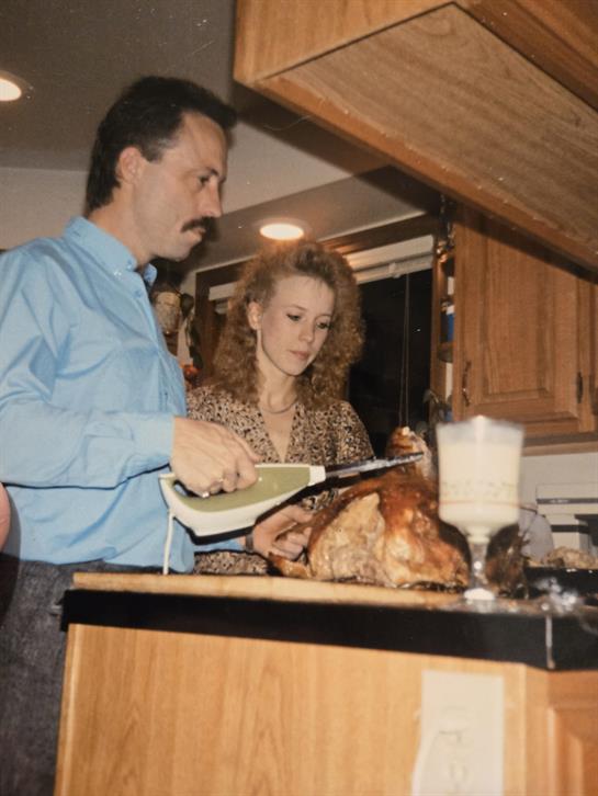 A man and woman cooking food