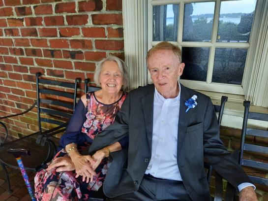 A man and woman sitting on a bench