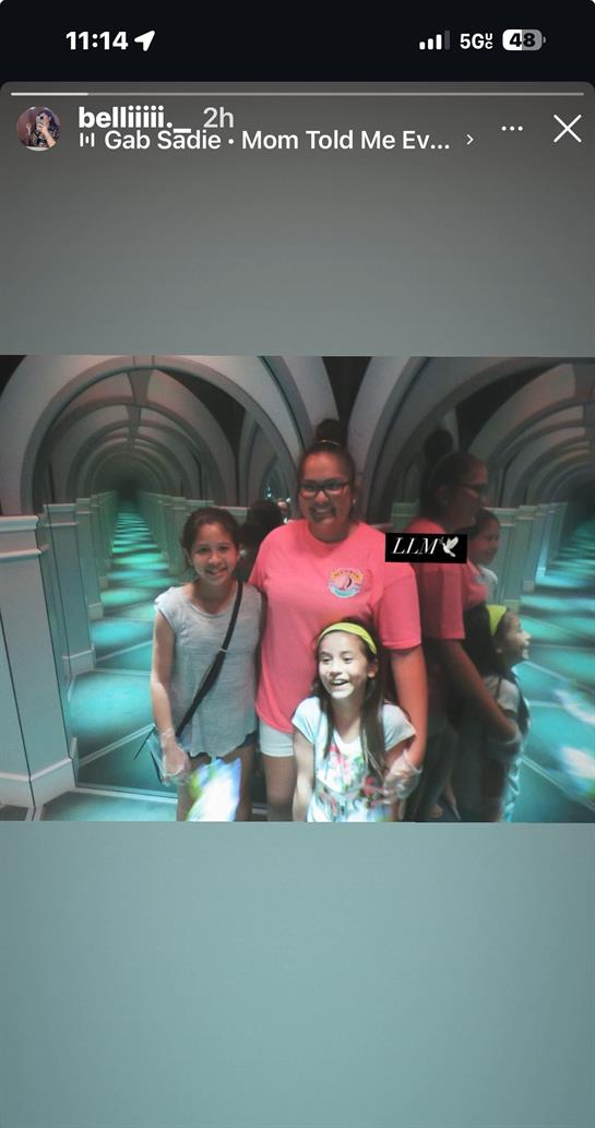 Friends share laughter and smiles while exploring a captivating mirrored corridor.