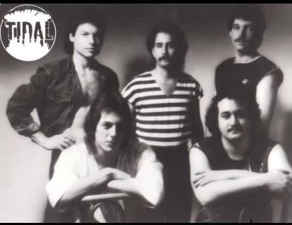 Five musicians stand together, showcasing their unique styles and camaraderie in a band photoshoot.